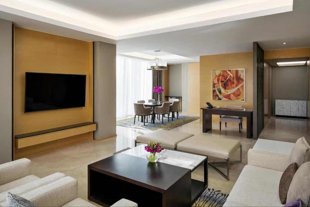 a living room with a couch and a table at Hyatt Regency Riyadh Olaya in Riyadh