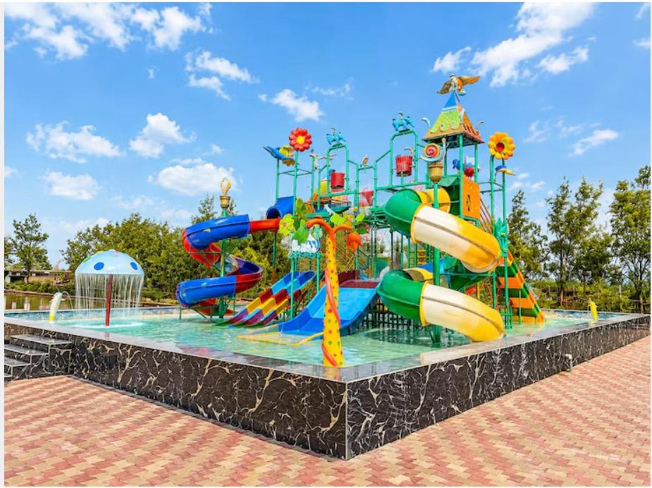 a water park with a colorful water slide at Lake View Village Resort in Tajpur