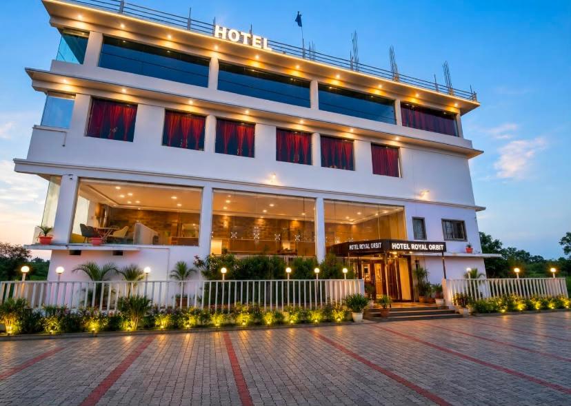 a hotel with a building with lights on it at Hotel Royal Orbit in Rajauli