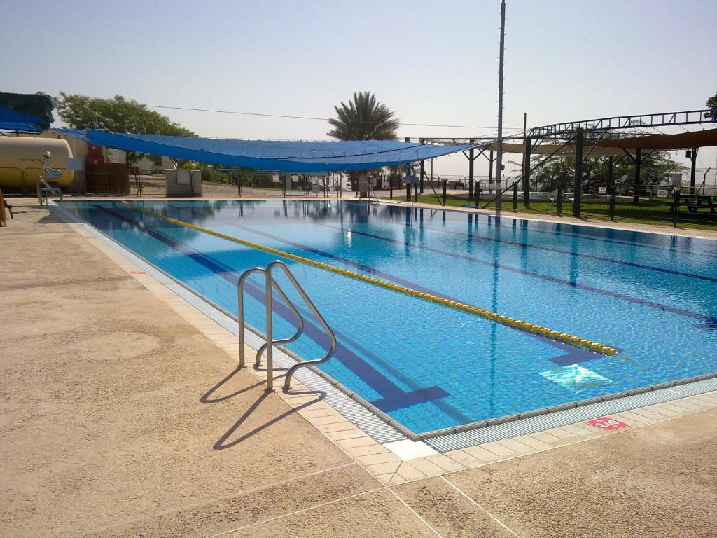 a large swimming pool with blue water at Nof Canaan in Kfar Adumim