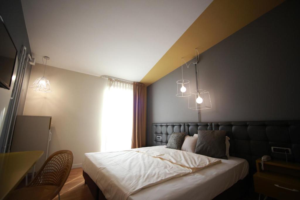 Postel nebo postele na pokoji v ubytování Hotel Corte Quadri