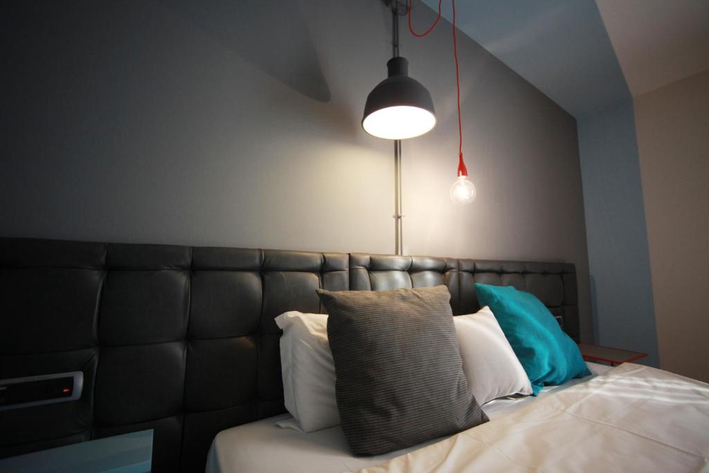 Postel nebo postele na pokoji v ubytování Hotel Corte Quadri