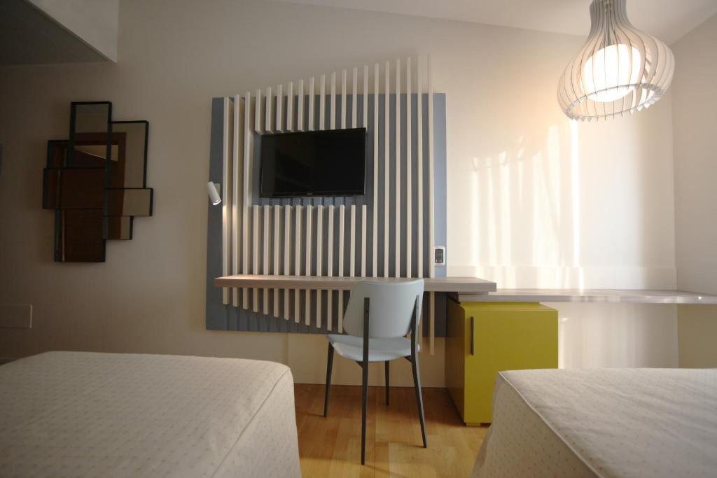 Postel nebo postele na pokoji v ubytování Hotel Corte Quadri