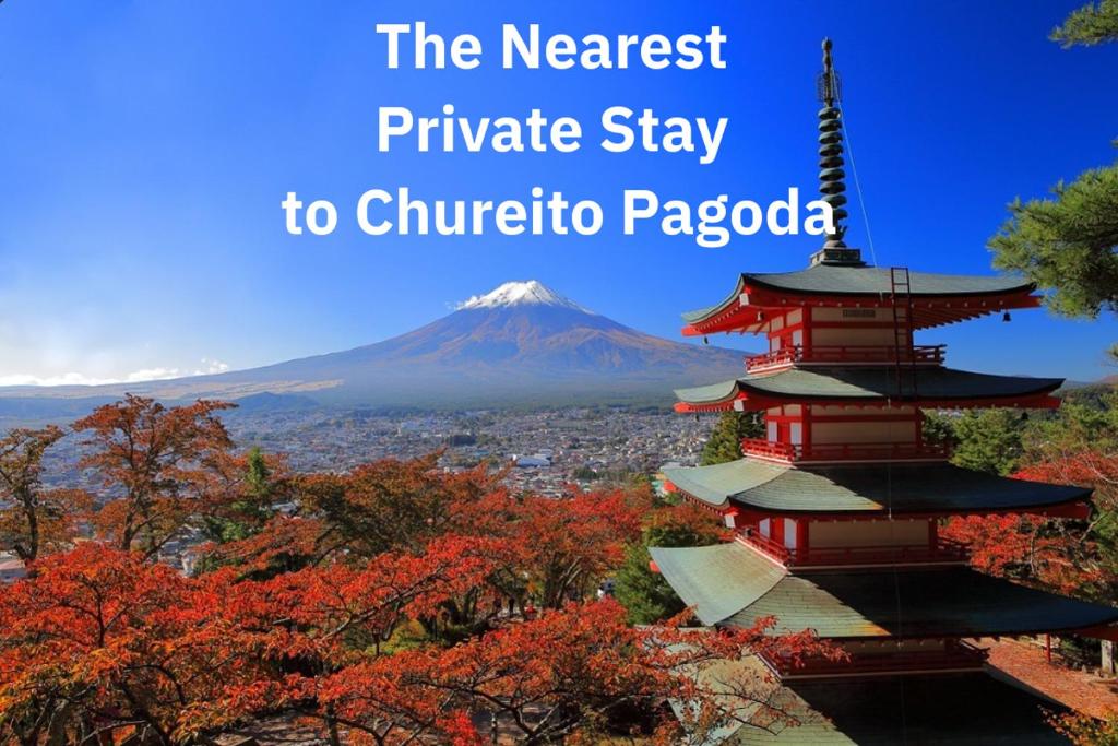 a pagoda in the foreground with a mountain in the background at The ONE -fujiyoshida- in Fujiyoshida