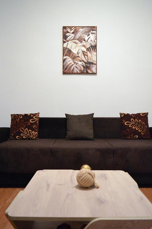 a living room with a couch and a table at D6 Lake View in Kastoria