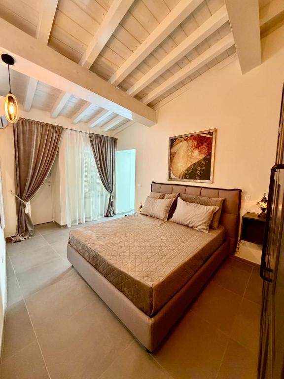 a bedroom with a large bed in a room at Borgo Carla in Massa