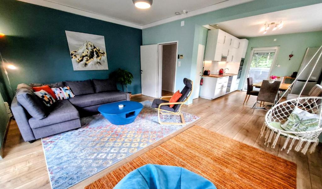 a living room with a couch and a table at Baker's Pond Apartment Two in Velden am Wörthersee