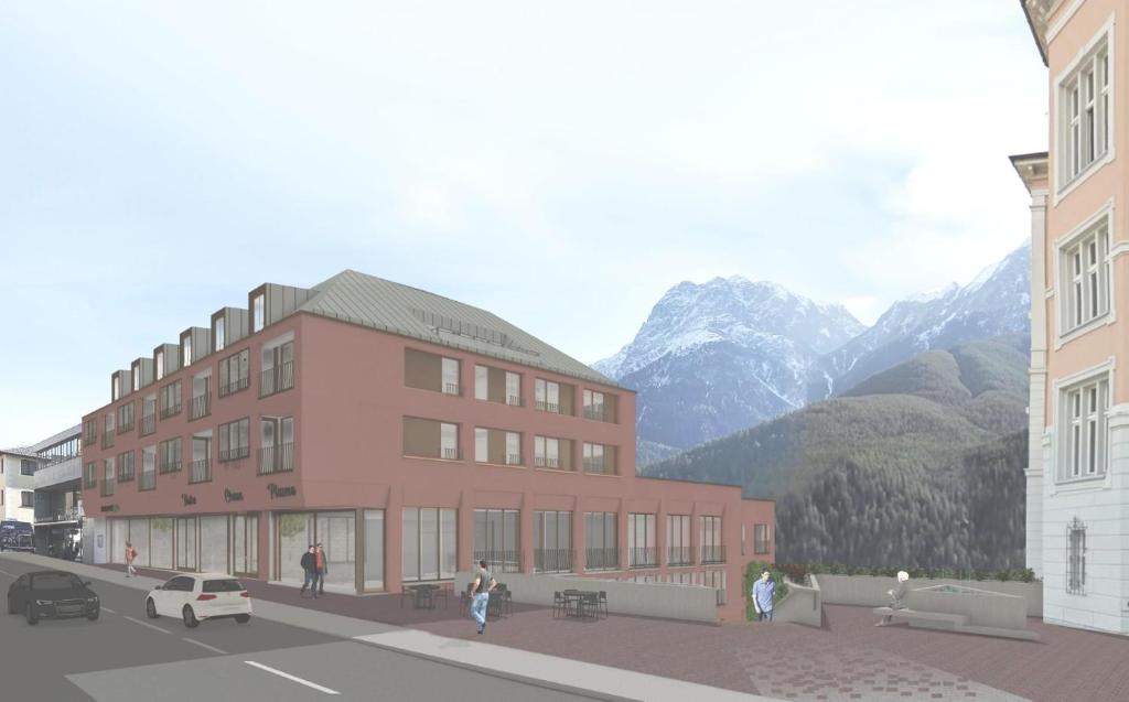 a rendering of a building with mountains in the background at Plavna Serviced Apartments in Scuol
