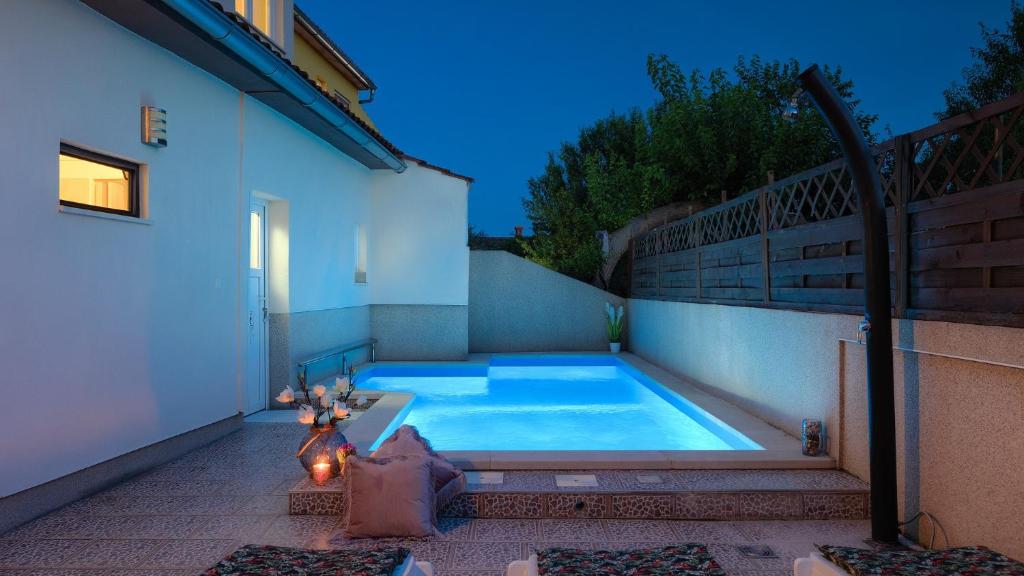 a swimming pool in the backyard of a house at Casa Aneri by Villas Guide in Pavicini