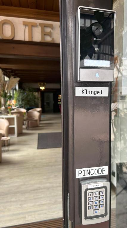 a parking meter in front of a building at Hotel Regina Suites in Sankt Augustin