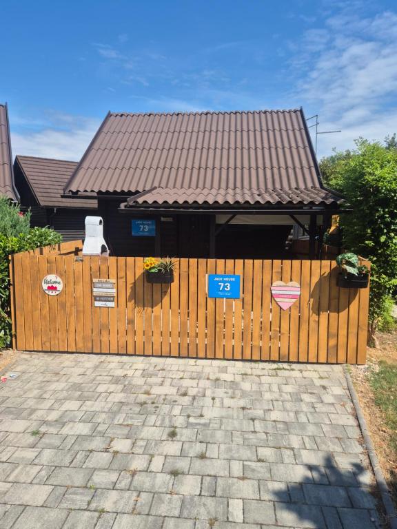 a wooden fence in front of a house at Jack House in Mostec