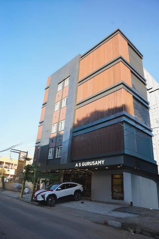 a car parked in front of a building at Hotel ASG Grand in Ranipet