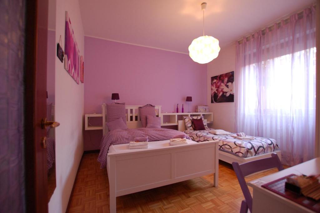 Postel nebo postele na pokoji v ubytování La Rosa Scarlatta Broseta