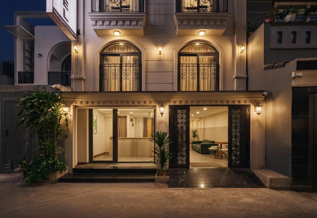 an exterior view of a building at night at Centoria Hotel By Urban B in Ho Chi Minh City