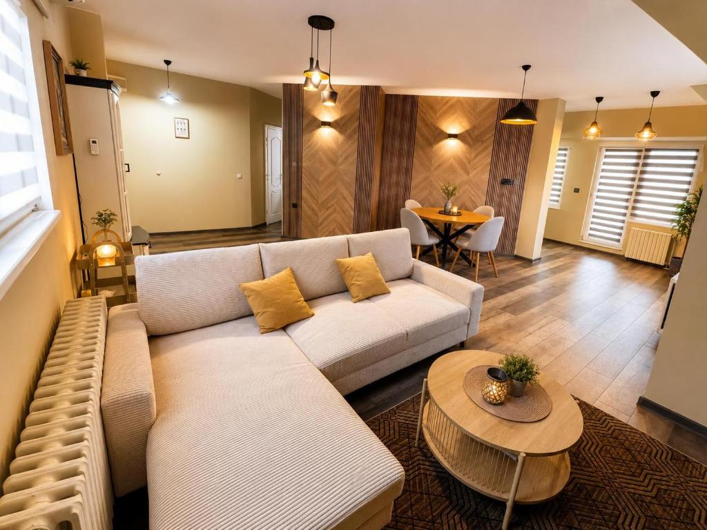 a living room with a couch and a table at BM Aparts Rustic in Pleven