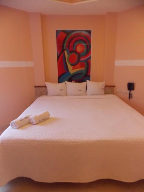 Postel nebo postele na pokoji v ubytování Hotel Express Alejandría