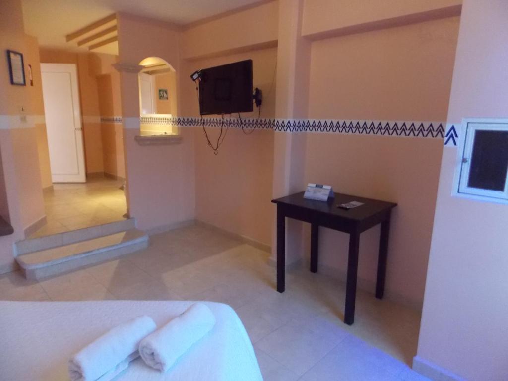 TV a/nebo společenská místnost v ubytování Hotel Express Alejandría