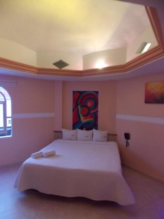 Postel nebo postele na pokoji v ubytování Hotel Express Alejandría