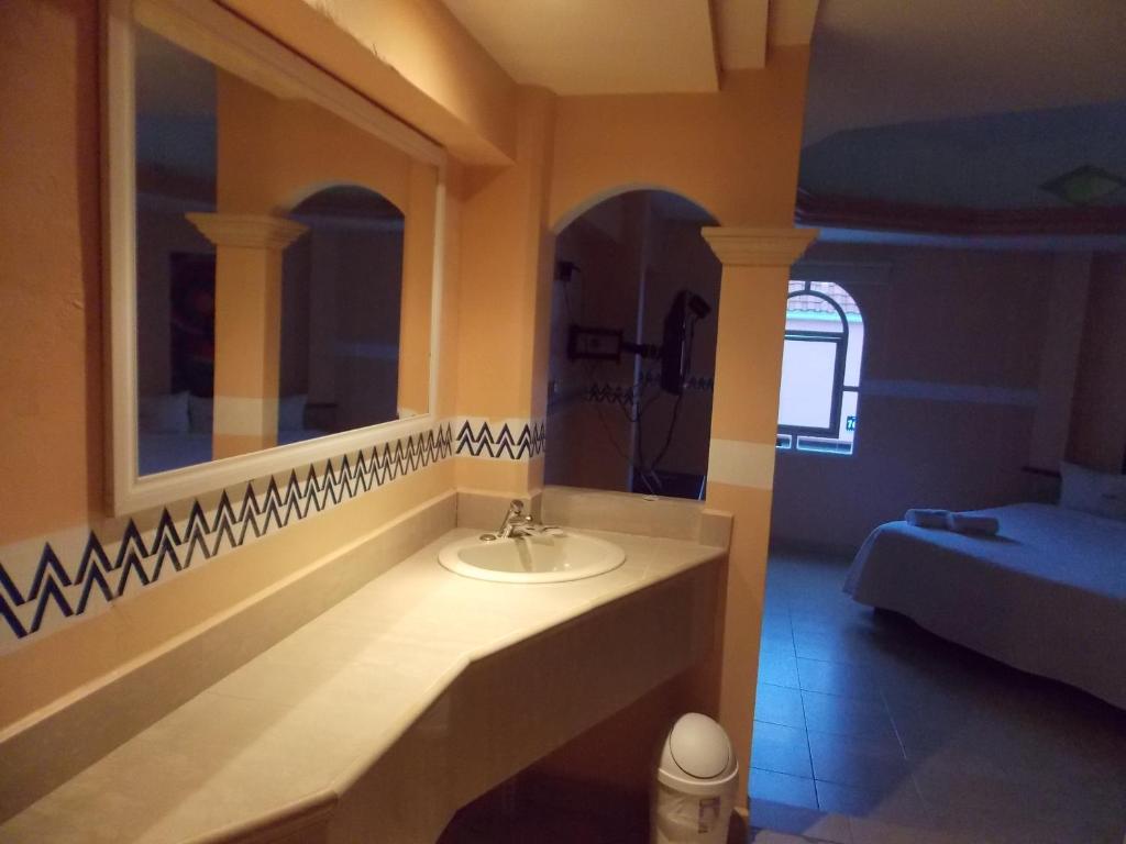Postel nebo postele na pokoji v ubytování Hotel Express Alejandría