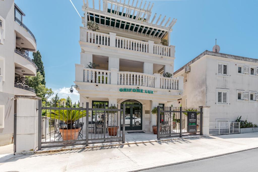 a building with a gate in front of it at Apartments Grifone Lux in Herceg-Novi