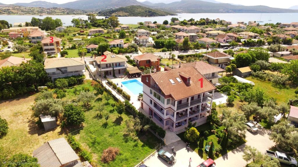 an aerial view of a house with a pool at Christina Studios in Lygia