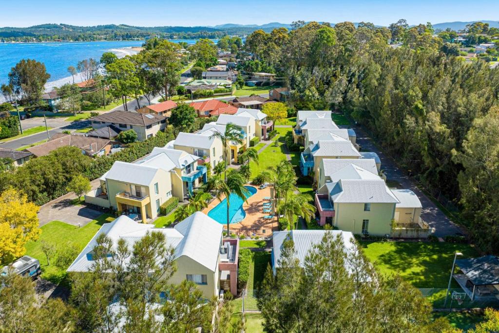 an aerial view of a resort with a pool at Bec's Beach House Getaway in Batemans Bay