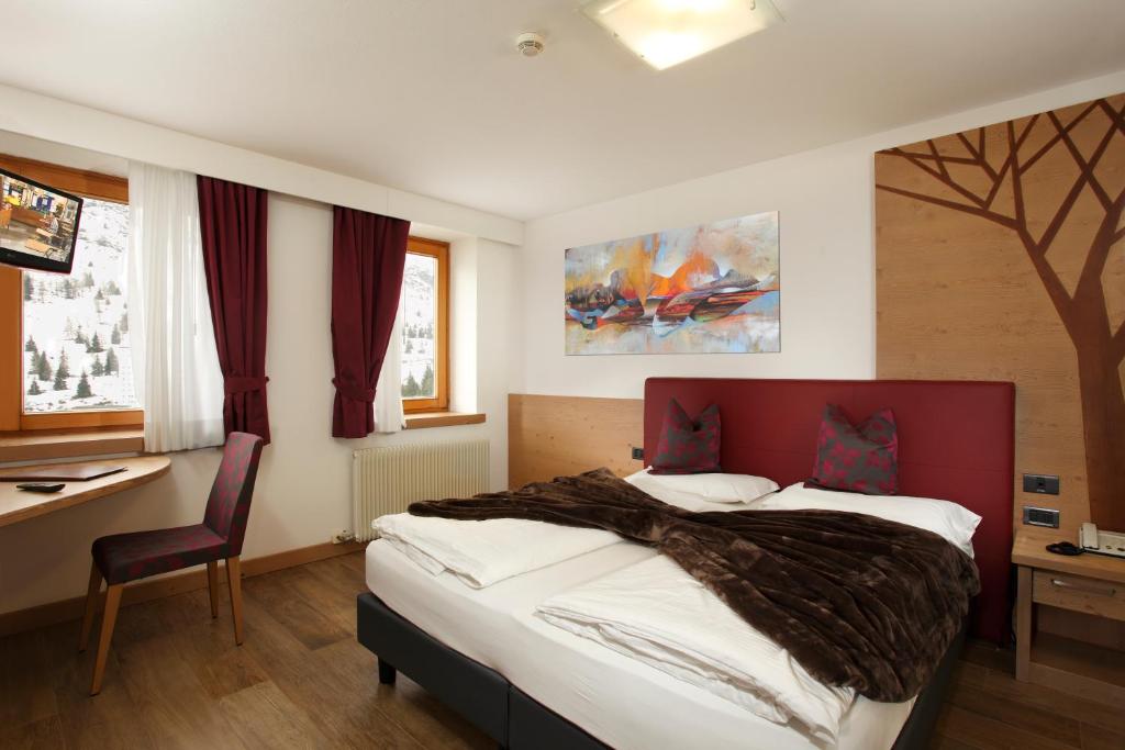 Posteľ alebo postele v izbe v ubytovaní Hotel Gardenia