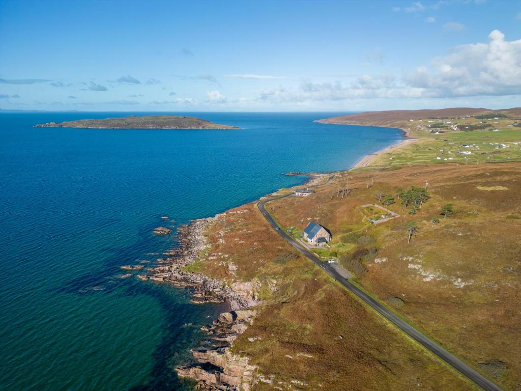 an aerial view of an island in the ocean at Gairloch Sands Youth Hostel in Gairloch