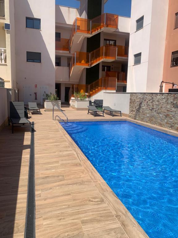 a swimming pool in the middle of a building at Basia in Torrevieja