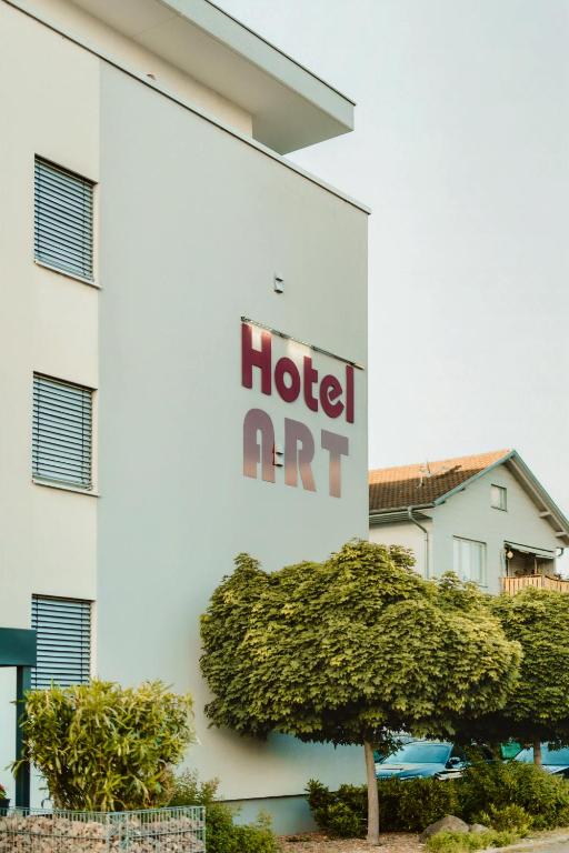 a hotel sign on the side of a building at ART Hotel Grenzach-Wyhlen bei Basel in Grenzach-Wyhlen