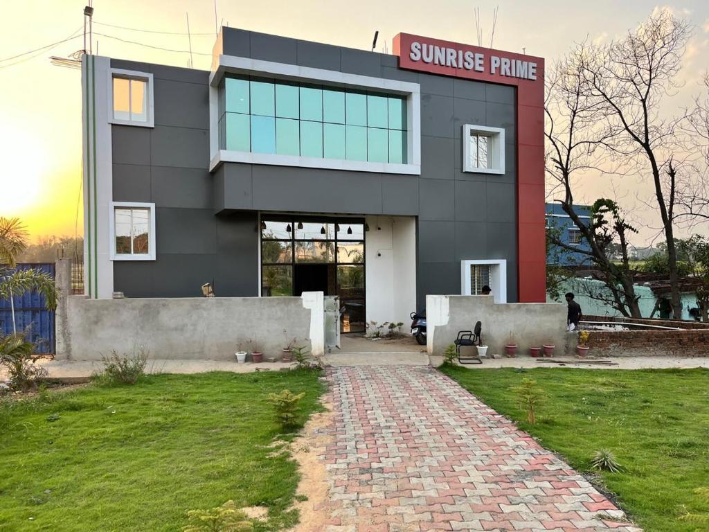 a building with a sunrise prime sign on it at Sunrise Prime in Kānke