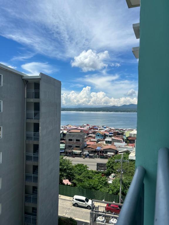 a view of a city and the water from a building at Davao Cozy Condo unit 1 in Davao City