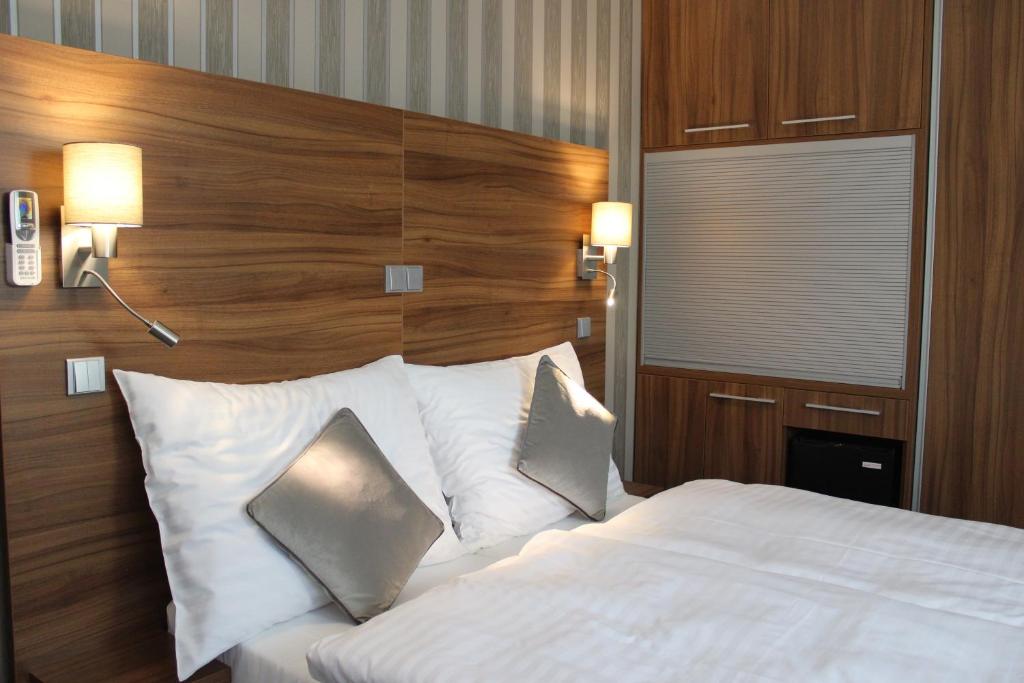 Postel nebo postele na pokoji v ubytování Hotel La Rosa