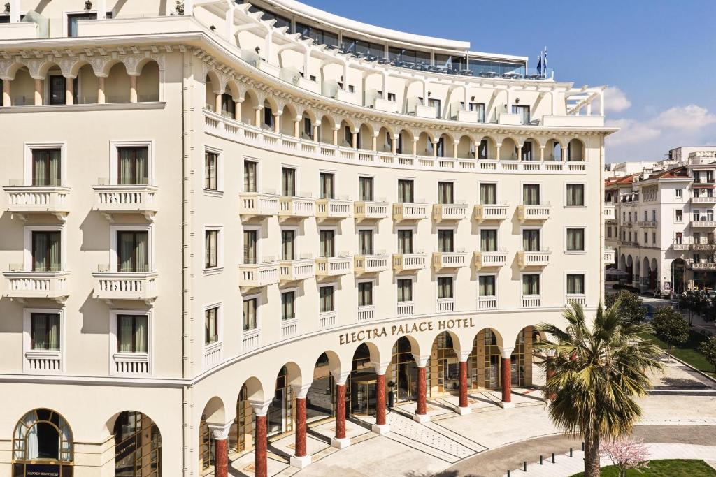 a white building with the hotel herzog palace hotel at Electra Palace Thessaloniki in Thessaloniki