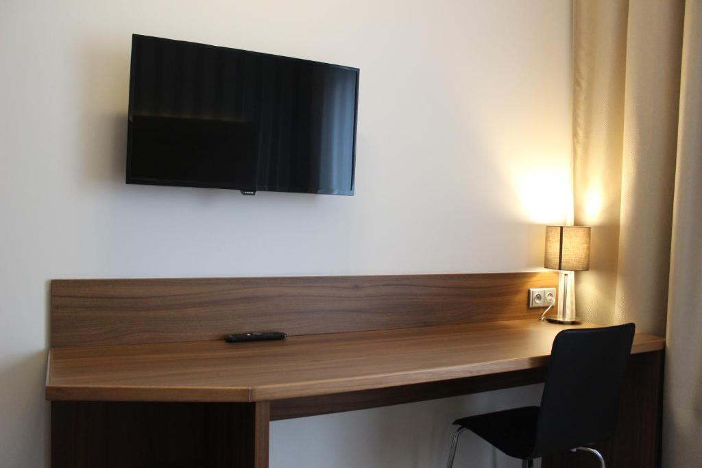 TV a/nebo společenská místnost v ubytování Hotel La Rosa