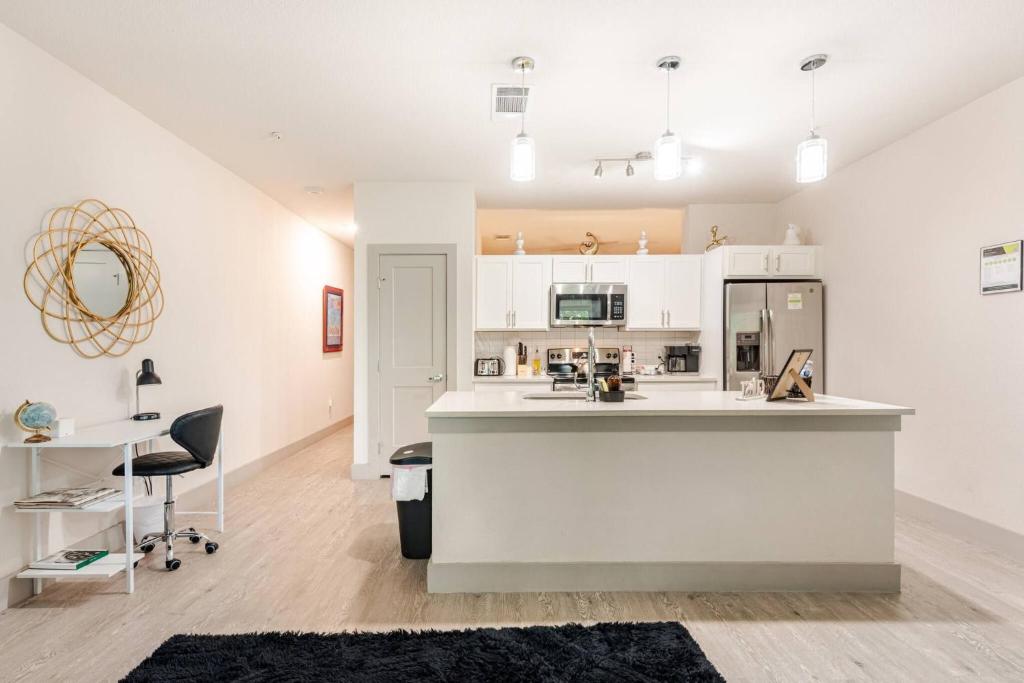 a kitchen with white cabinets and a counter top at Riverwalk View Luxe Condo Views Pool Free Parking in San Antonio
