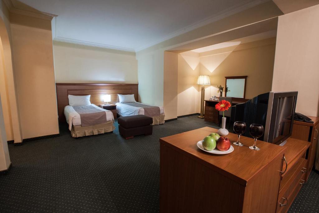 Postel nebo postele na pokoji v ubytování Aviatrans Hotel