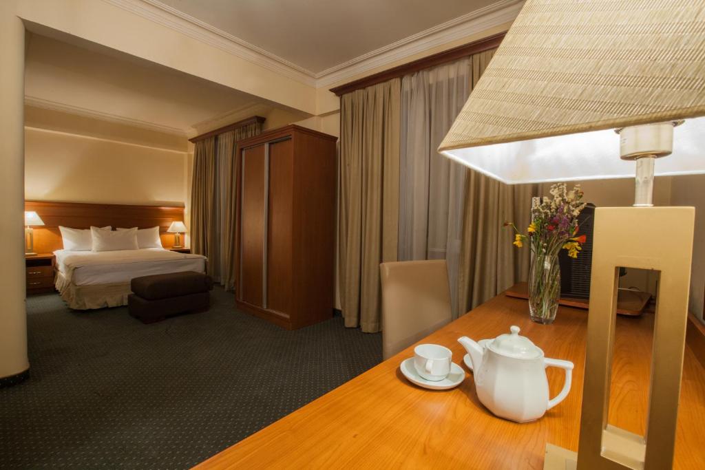 Postel nebo postele na pokoji v ubytování Aviatrans Hotel