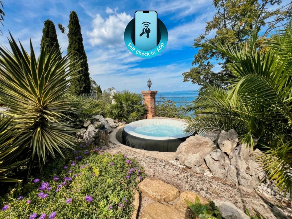 a garden with a hot tub in the middle at SunVilla with hot tub in Koper