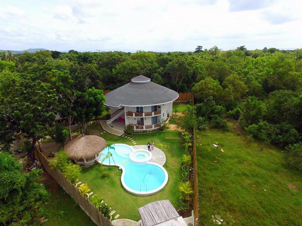 an aerial view of a house with a swimming pool at Bohol Dreamcatcher Resort in Panglao Island