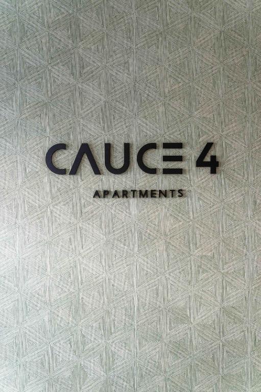 a close up of the cuddleagents sign on a building at Cauce 4 Apartments in Torremolinos
