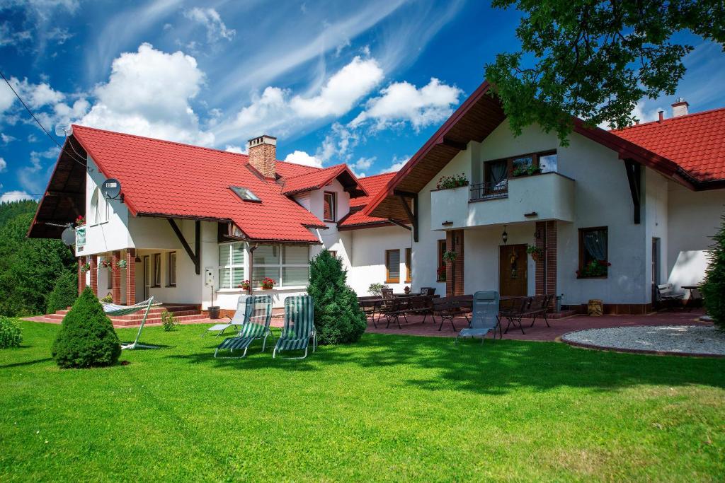 a house with a red roof at U Kieszów - Alicja Kiesz in Ustrzyki Dolne