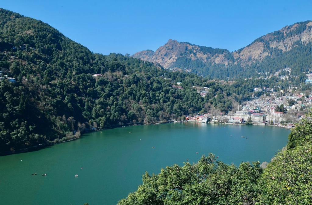 a view of a lake in the mountains at The Lake BnB in Nainital