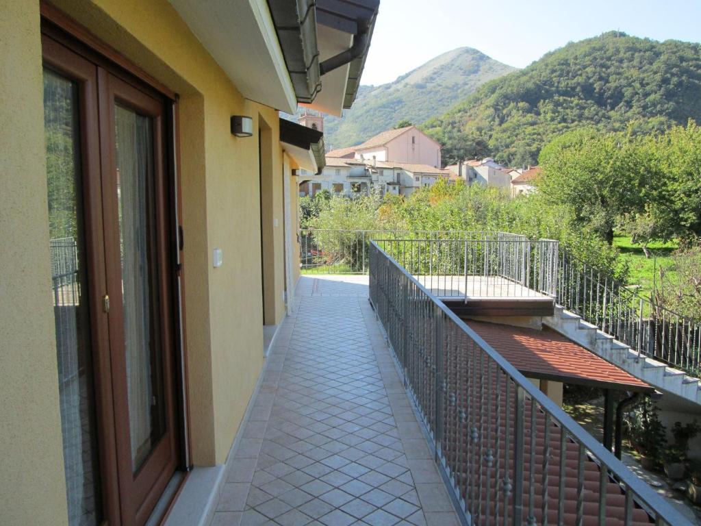 a balcony of a building with a view of a mountain at House biase e marrys in Trecchina