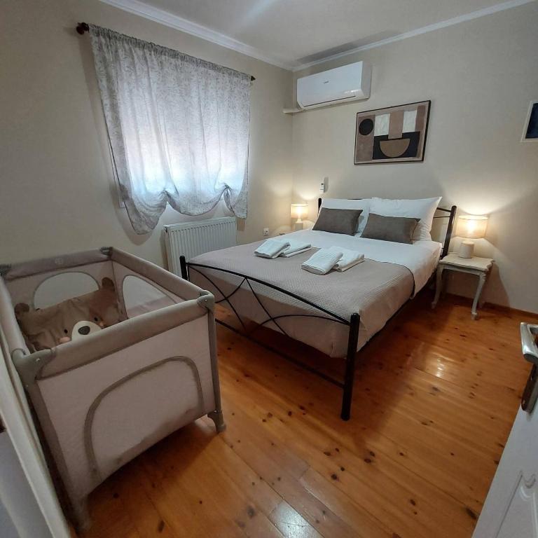 a bedroom with a bed with a dog laying on it at The Mastiha Spot 5 in Chios