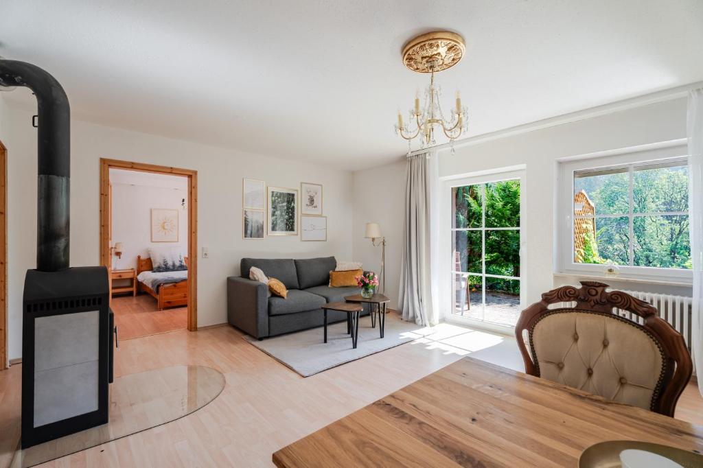 a living room with a couch and a fireplace at Rai Mattiss in Oberharmersbach