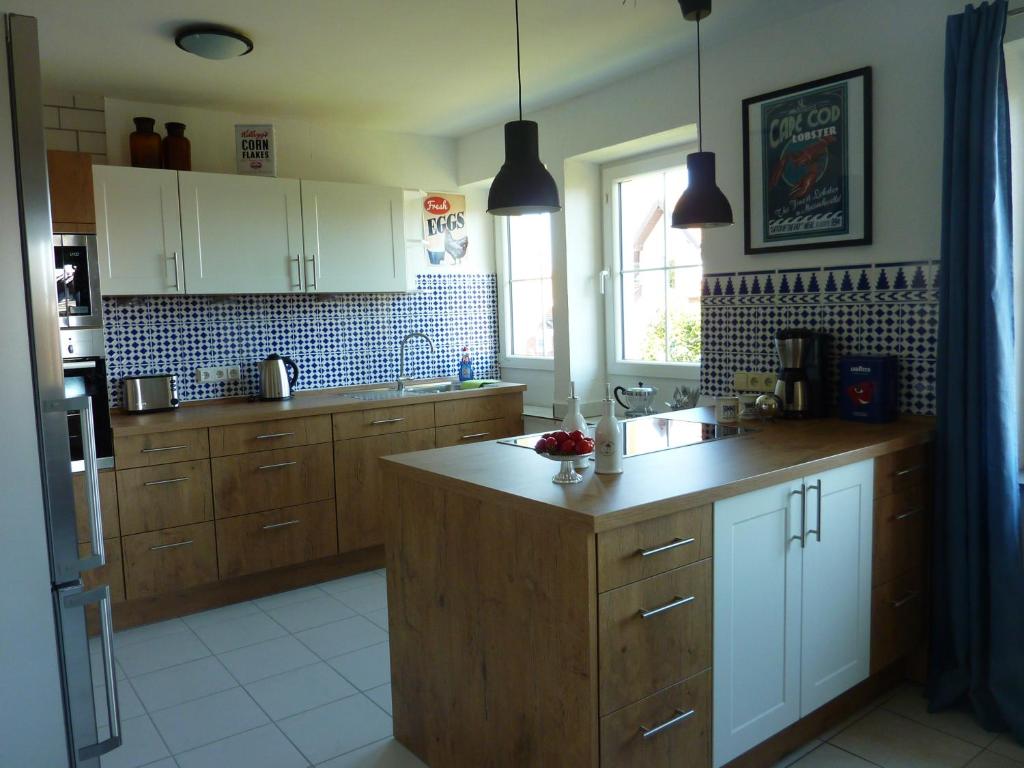 a kitchen with wooden cabinets and a counter top at Schwarzwald light in Freudenstadt