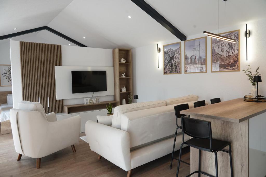 a living room with a couch and a table at Kostadinov Residence in Demir Kapija