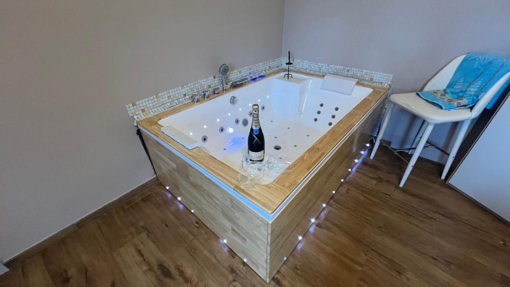 a bath tub with a bottle of champagne in it at Cinque terre - Laspezia - Loft 1910 in La Spezia