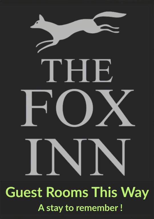 a sign that reads guest rooms this way a stay to remember at The Fox Inn in Steventon